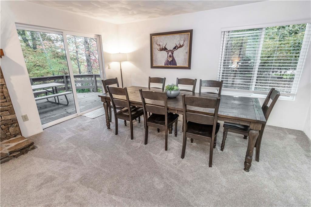 1821 Eagles Ridge Terrace Hidden Valley, PA 15502 - Photo 10 of 49 a dining room with furniture and large windows