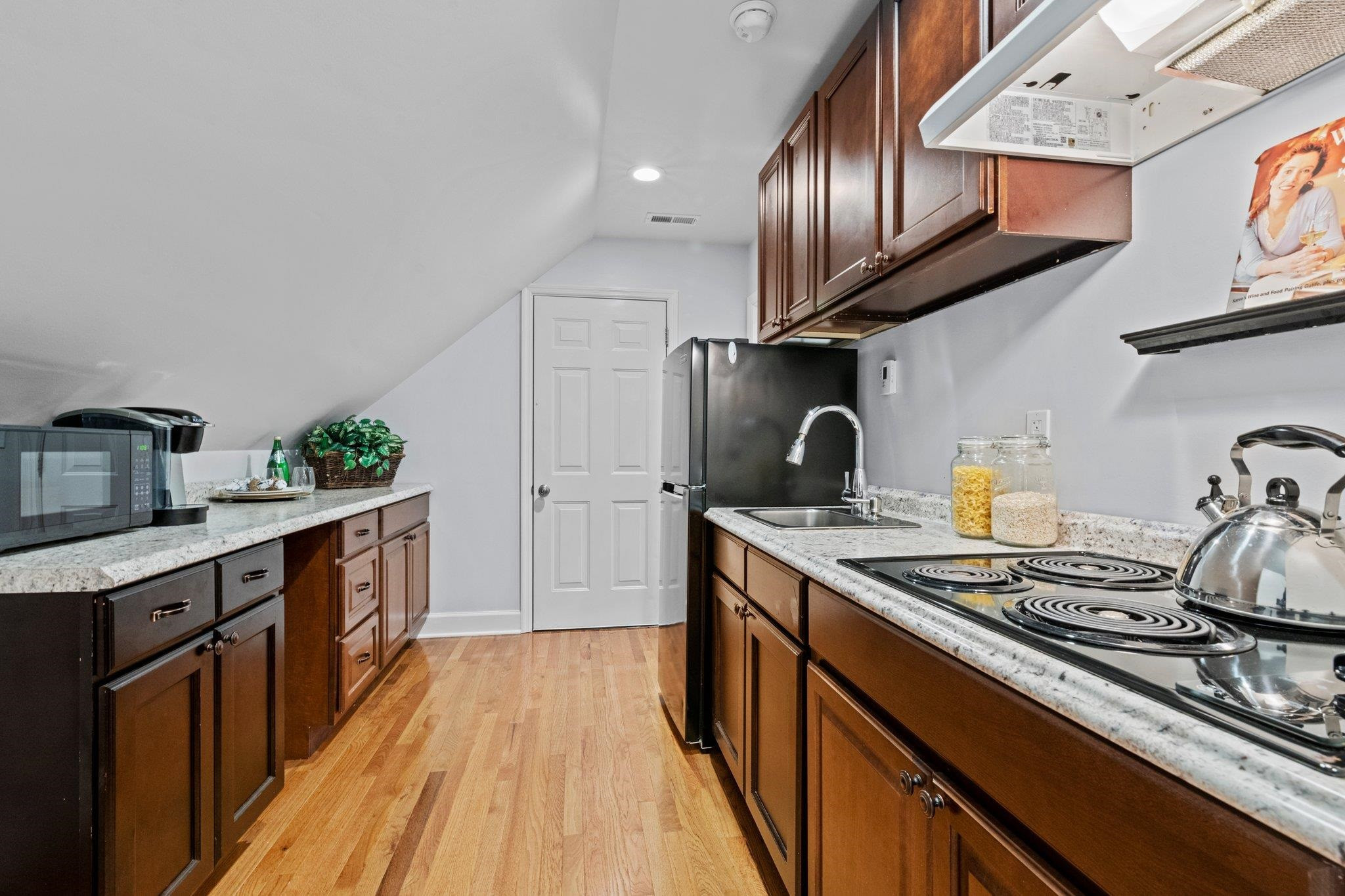 525 Eatmon Road Zebulon, NC 27597 - Photo 22 of 30 Kitchen in apartment above garage with electric cooktop Apartment Kitchen