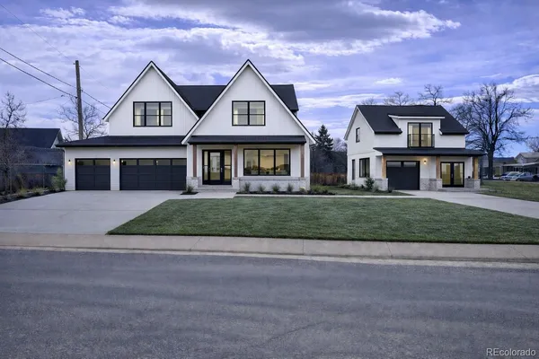 front view of a house next to a yard