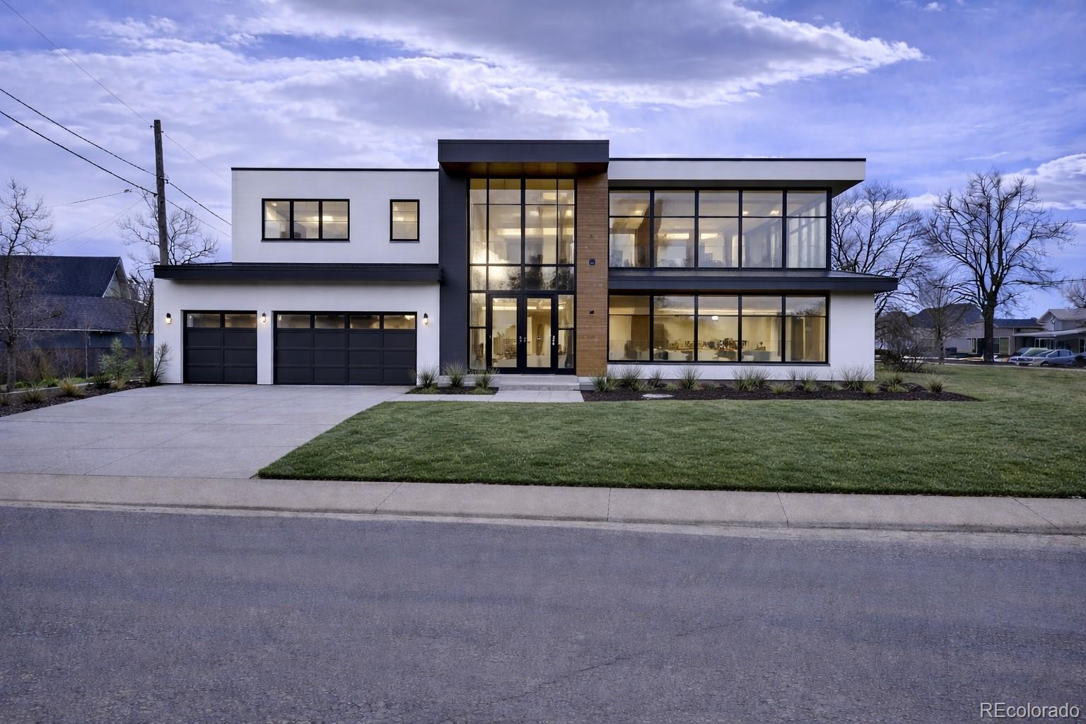 3292 Benton Street Wheat Ridge, CO 80212 - Photo 7 of 12 a front view of a house with a garden