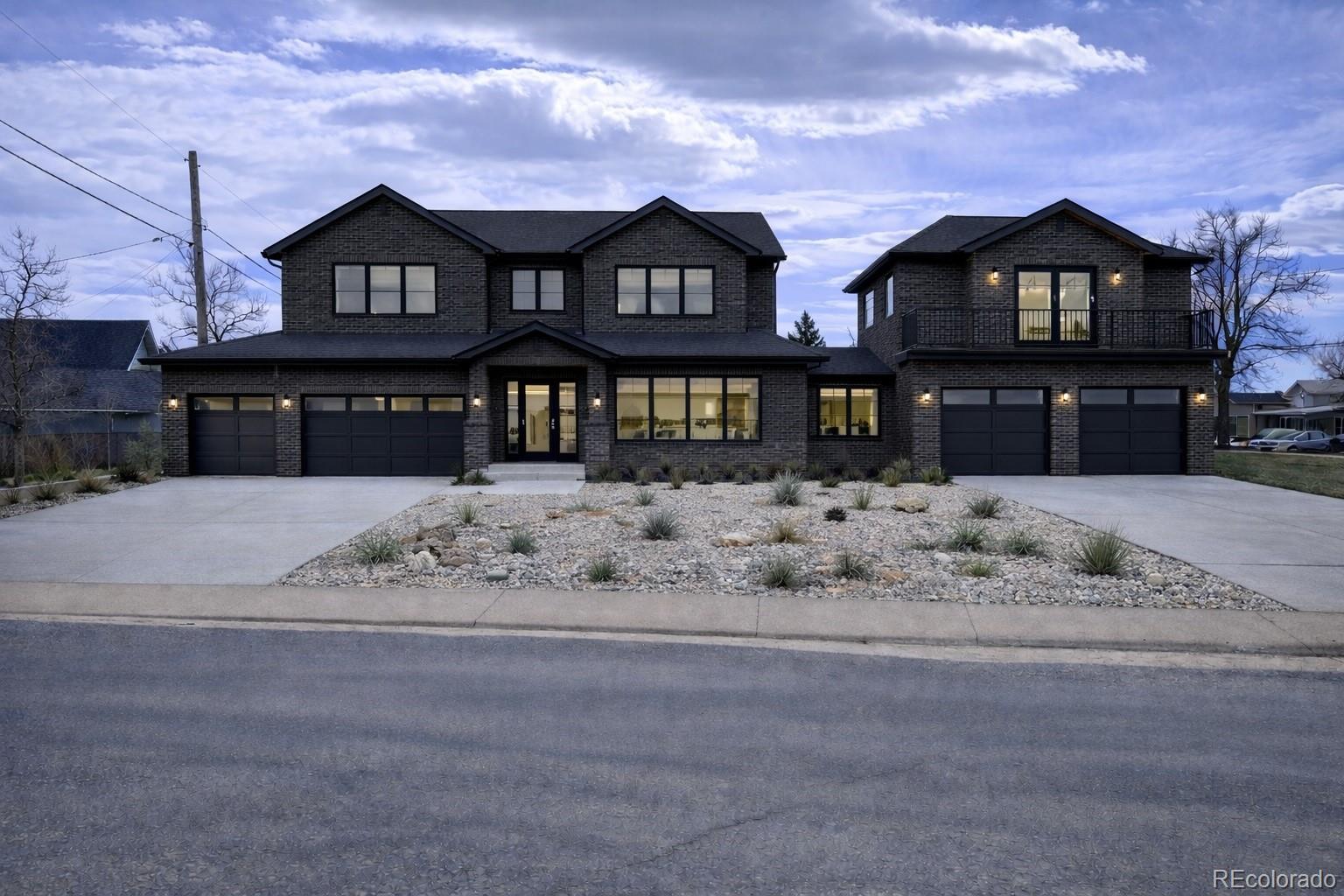 3292 Benton Street Wheat Ridge, CO 80212 - Photo 8 of 12 a front view of a residential apartment building with a yard
