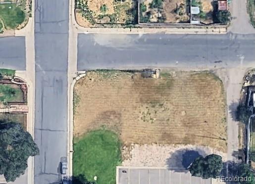 3292 Benton Street Wheat Ridge, CO 80212 - Photo 9 of 12 front view of a brick house with a yard