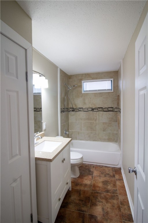 1804 North McKinley Street Beeville, TX 78102 - Photo 7 of 15 a bathroom with a sink a toilet and shower