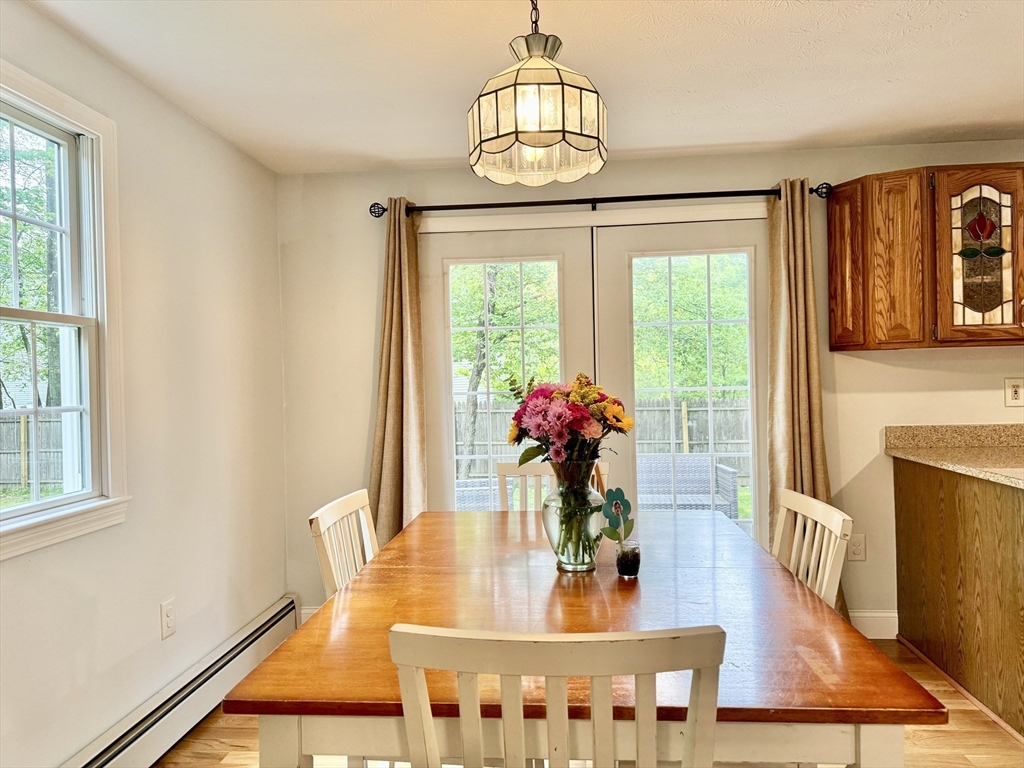 29 Whitewood Road Groton, MA 01450 - Photo 14 of 38 a view of a dining room with furniture window and wooden floor