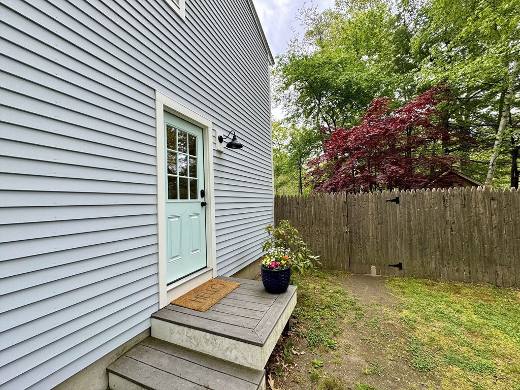 29 Whitewood Road Groton, MA 01450 - Photo 36 of 38 a backyard of a house with lots of green space