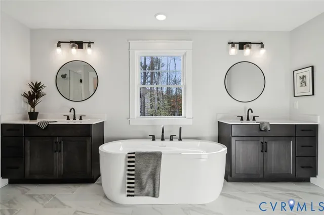 a bathroom with a double vanity sink and a mirror