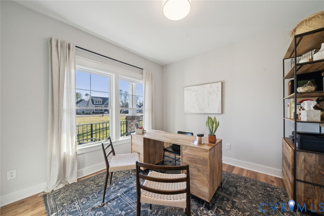2471 Old Telegraph Road Providence Forge, VA 23140 - Photo 6 of 25 a dining room with furniture a rug and wooden floor