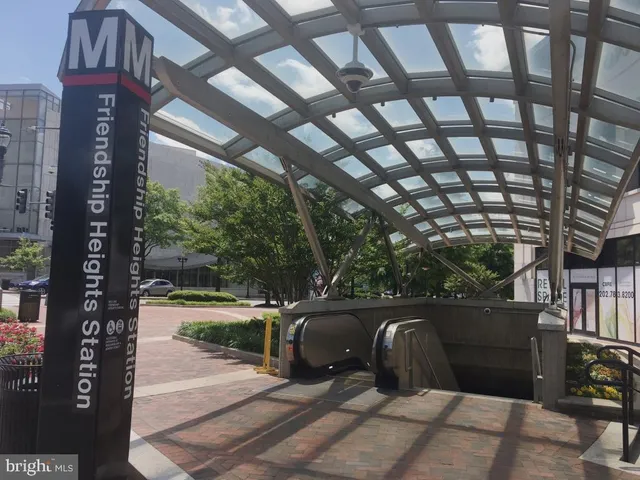 a view of outdoor space with a garden and signage