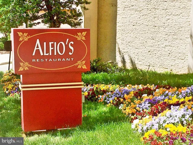 a view of swimming pool with outdoor seating