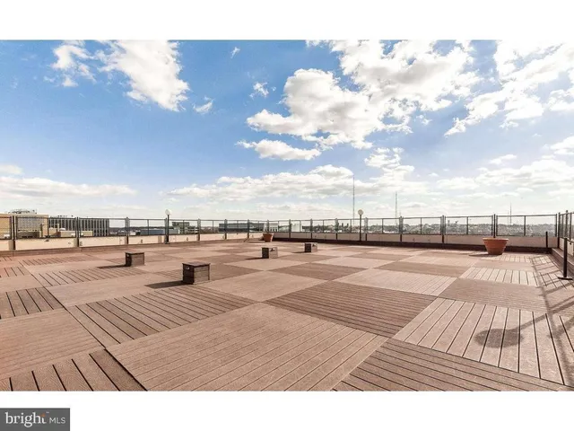 a room with gym equipment and mirror