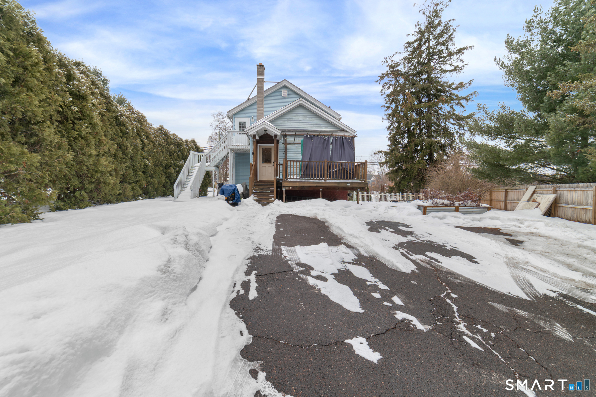 25 High Street Windsor, CT 06095 - Photo 12 of 40 a view of a house with a snow in the yard