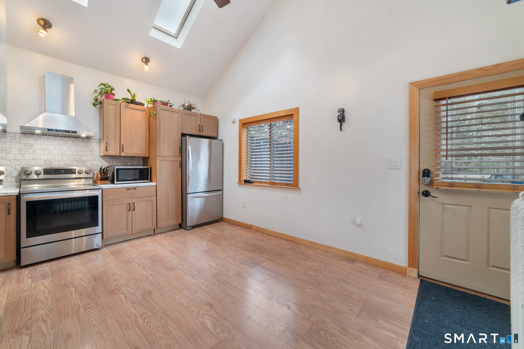 25 High Street Windsor, CT 06095 - Photo 16 of 40 a kitchen with granite countertop a refrigerator stove and sink