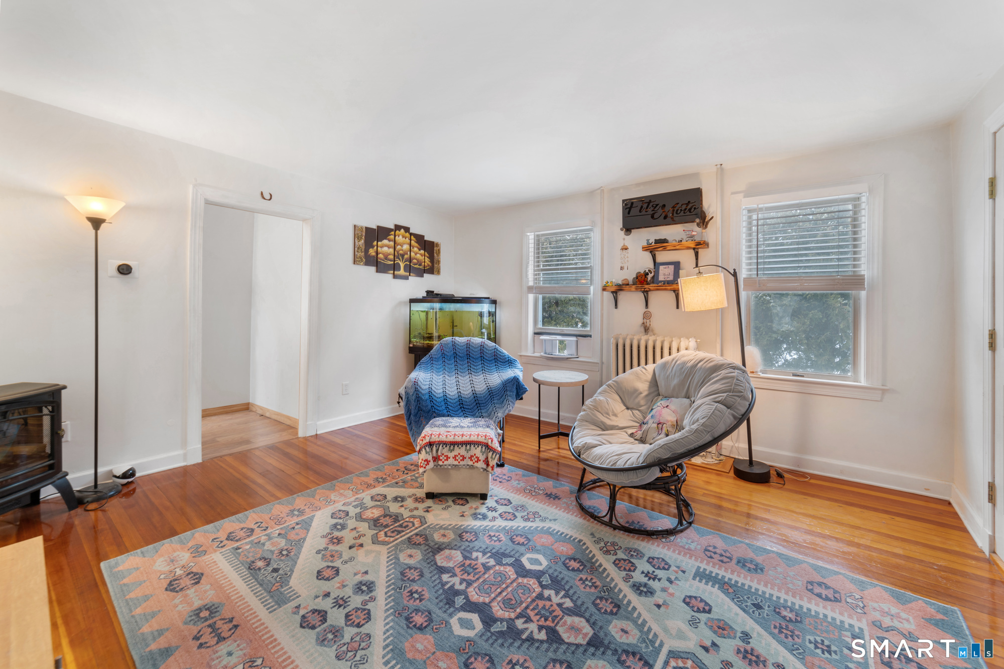 25 High Street Windsor, CT 06095 - Photo 17 of 40 a living room with furniture and a window