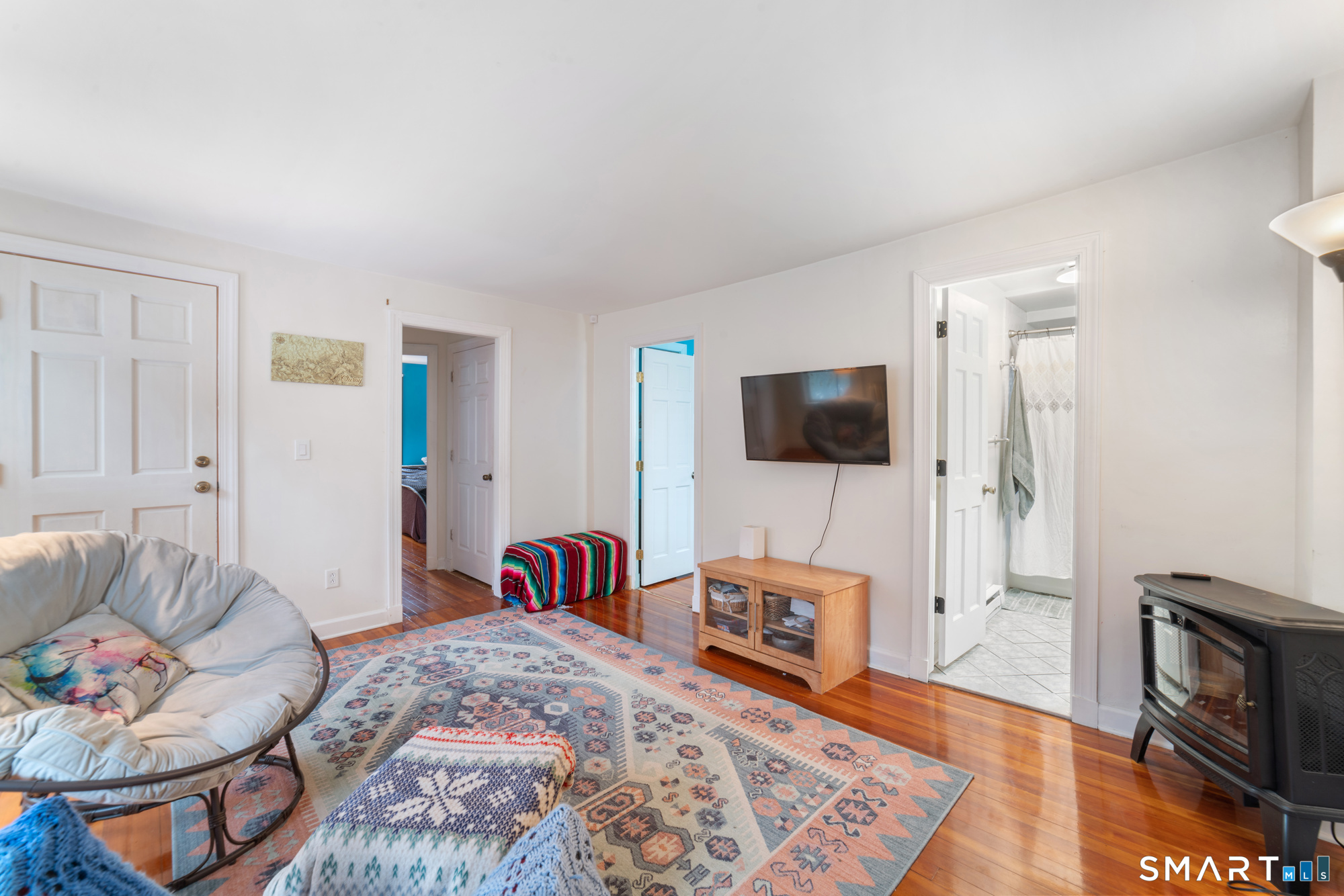 25 High Street Windsor, CT 06095 - Photo 18 of 40 a living room with furniture and a flat screen tv