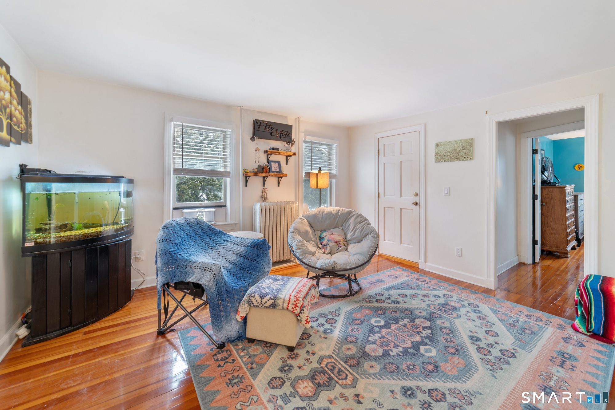 25 High Street Windsor, CT 06095 - Photo 19 of 40 a living room with furniture and a flat screen tv