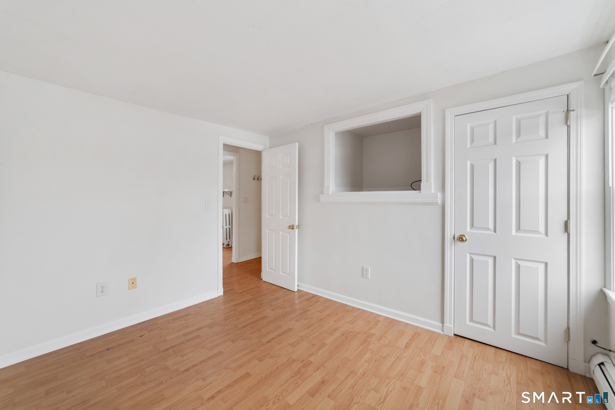25 High Street Windsor, CT 06095 - Photo 2 of 40 a view of an empty room with wooden floor