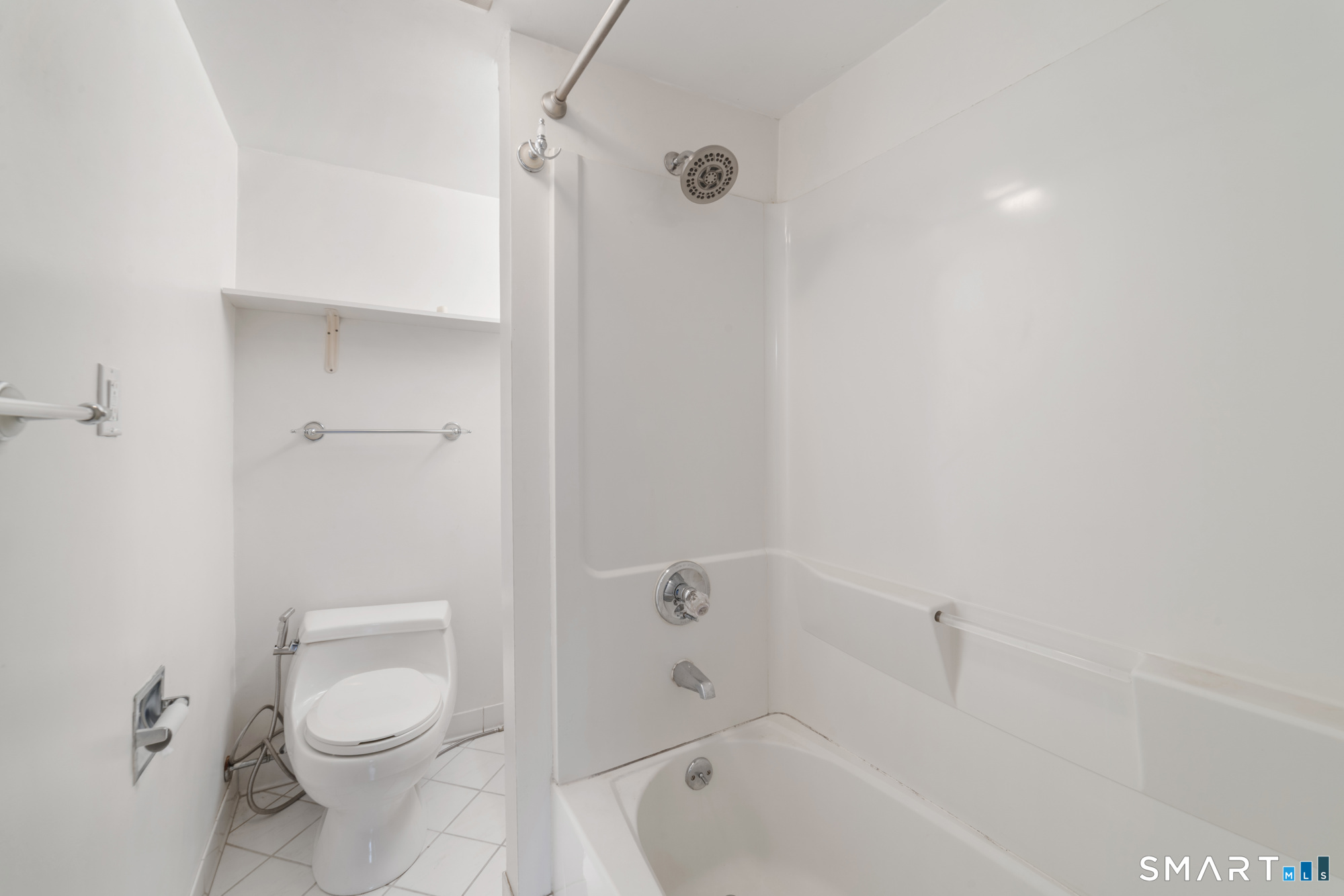 25 High Street Windsor, CT 06095 - Photo 27 of 40 a bathroom with a toilet and shower