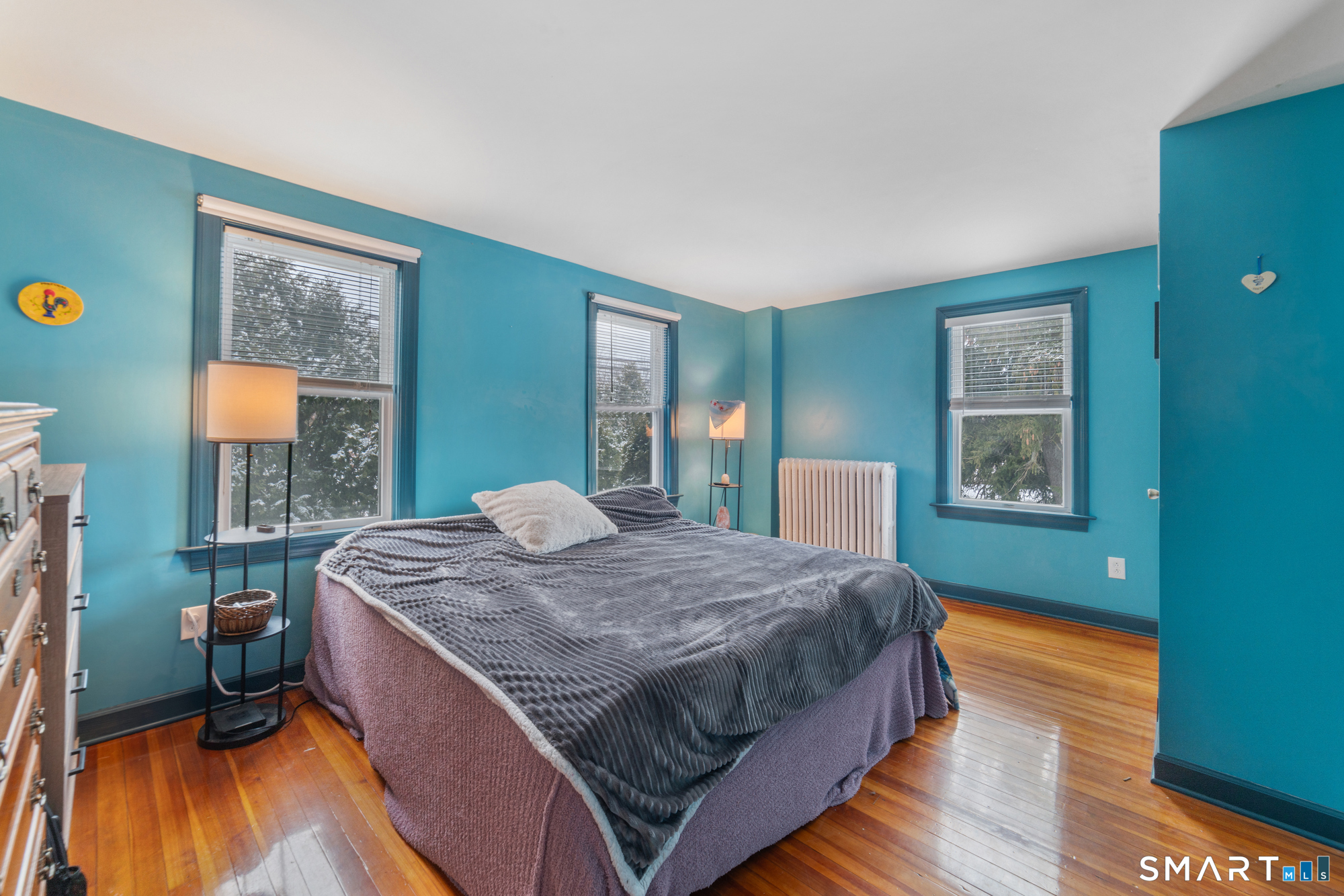 25 High Street Windsor, CT 06095 - Photo 31 of 40 a bedroom with a bed dresser and a window