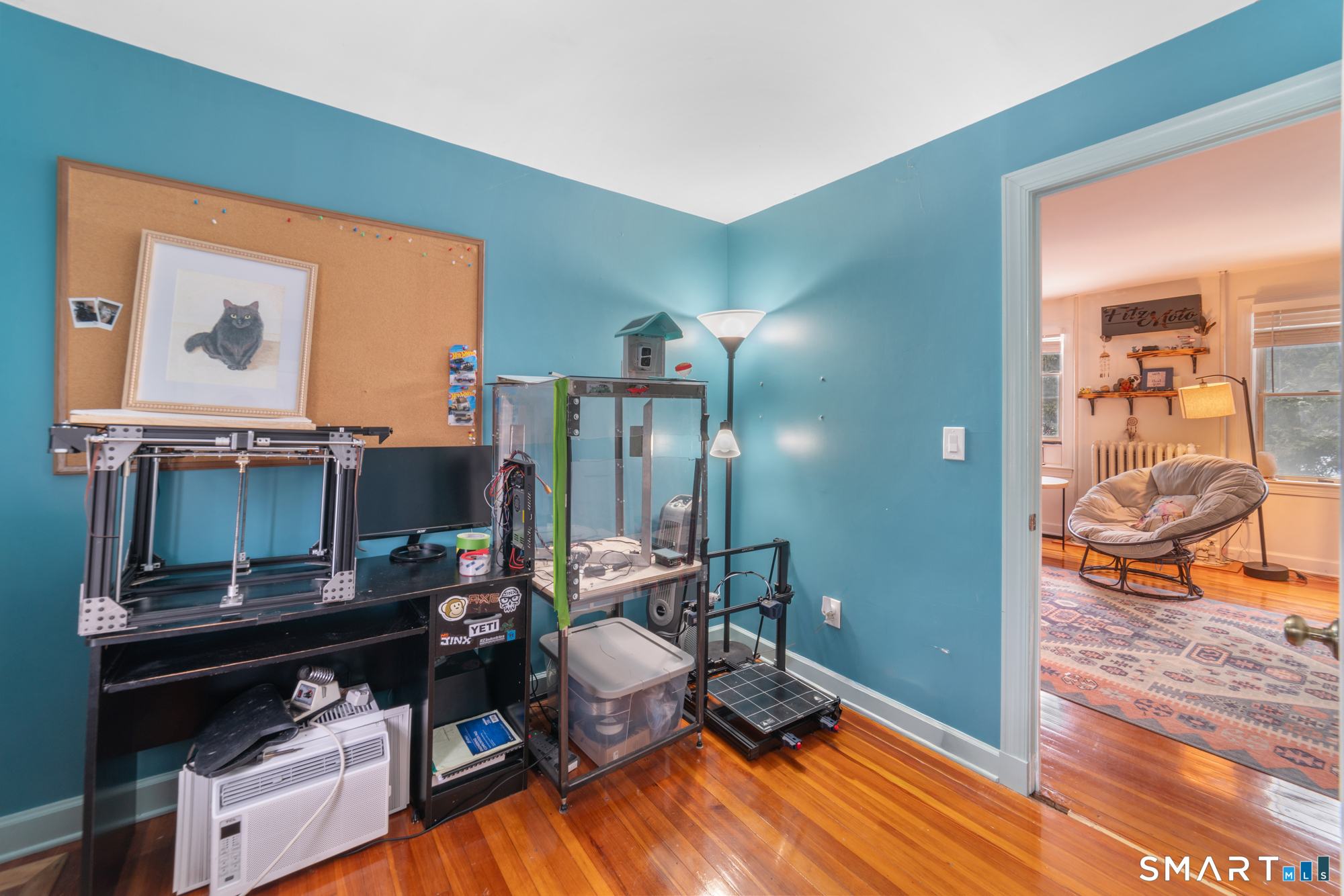 25 High Street Windsor, CT 06095 - Photo 34 of 40 a living room with furniture and a flat screen tv