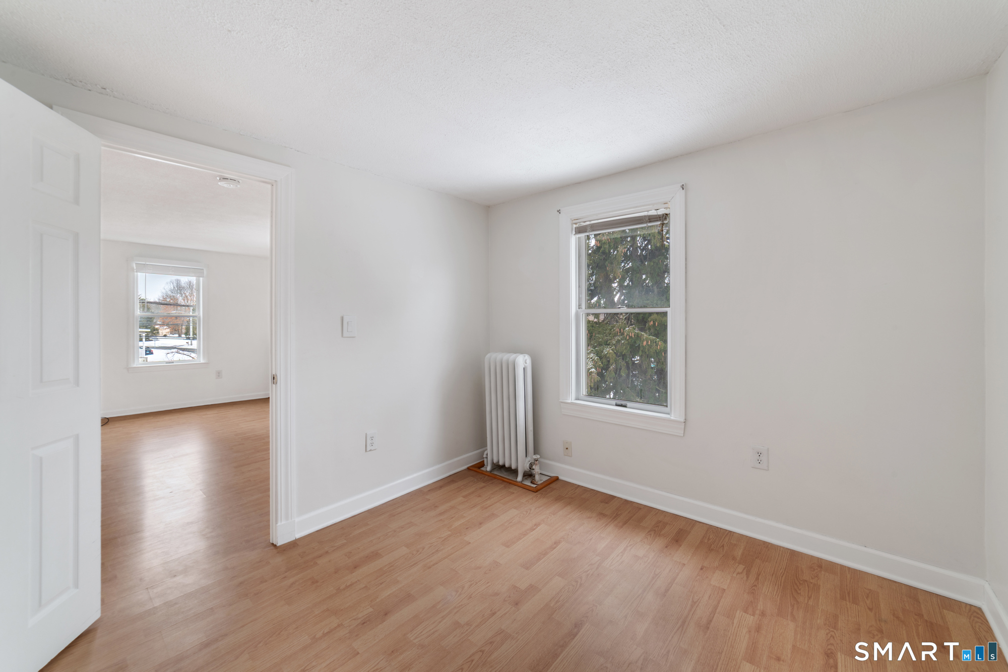 25 High Street Windsor, CT 06095 - Photo 6 of 40 an empty room with windows and closet