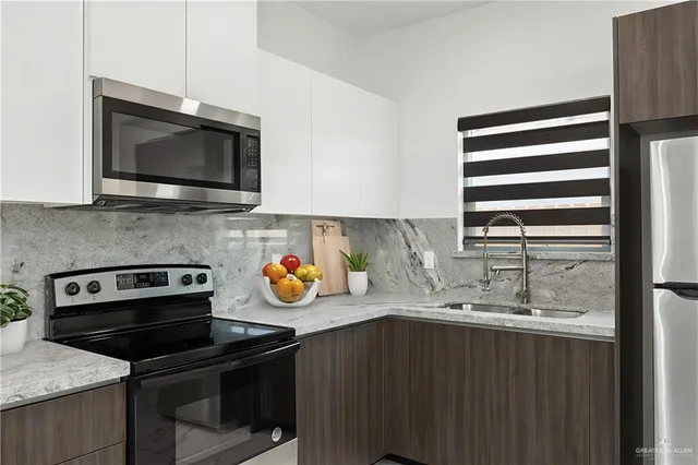 a kitchen with a stove and a microwave