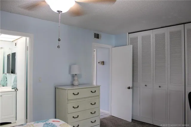 a white toilet sitting next to a shower