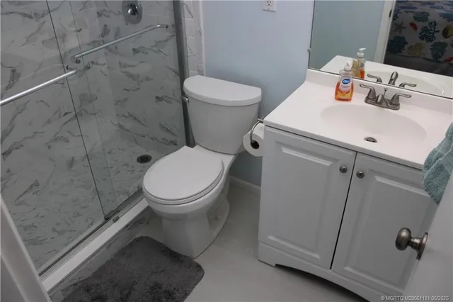 a bathroom with a toilet and a sink