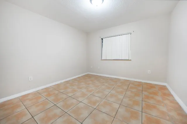 an empty room with white walls