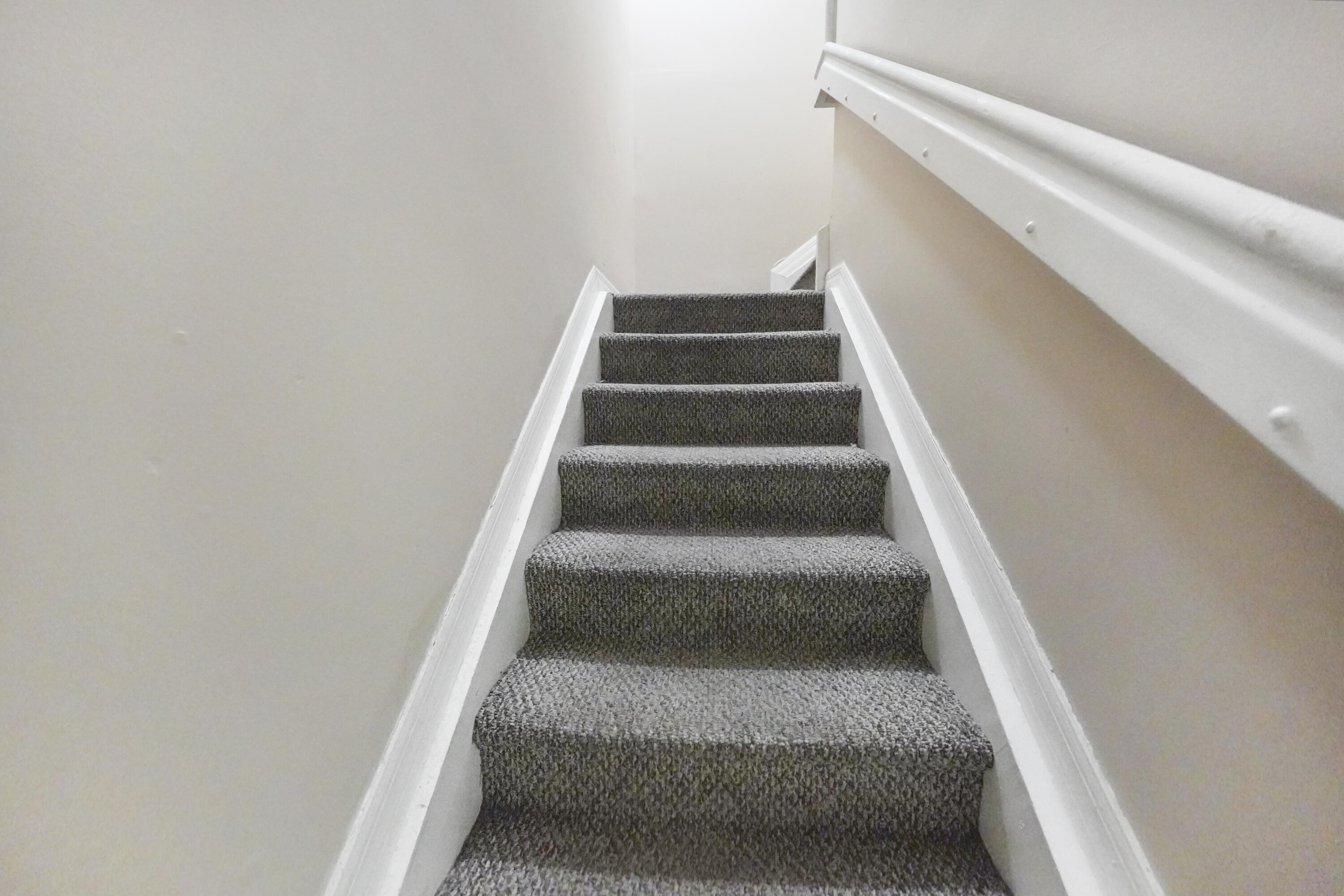 14142 Southwest 260th Street, Unit 105 Homestead, FL 33032 - Photo 7 of 17 a view of staircase with white walls