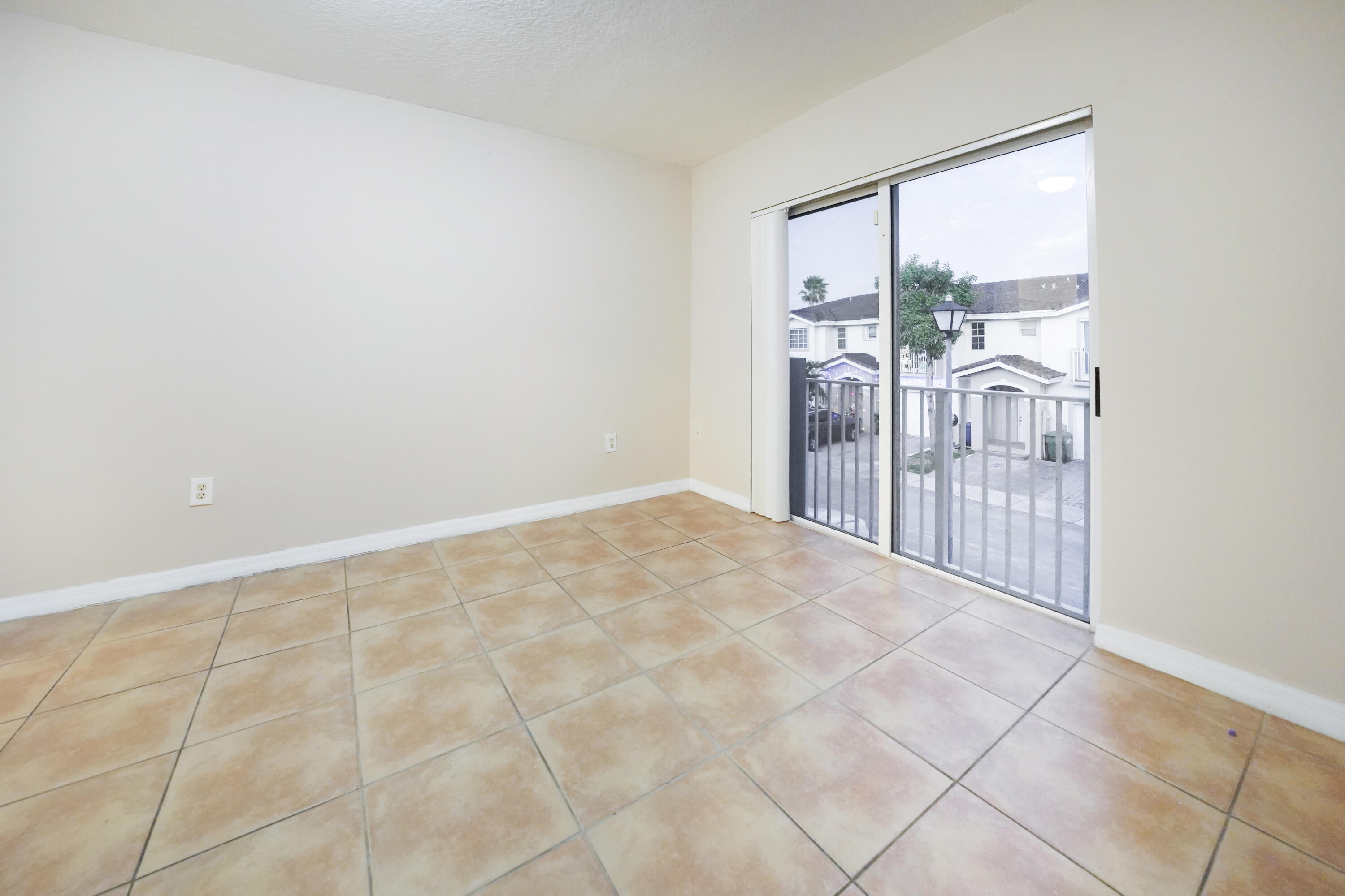 14142 Southwest 260th Street, Unit 105 Homestead, FL 33032 - Photo 9 of 17 a view of a room with a large window