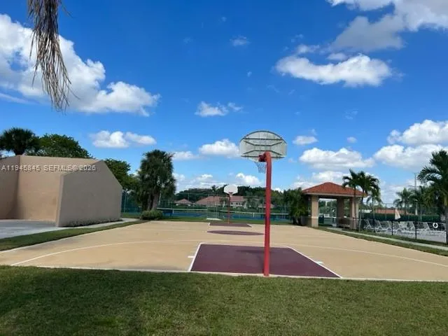 a view of a park with large trees