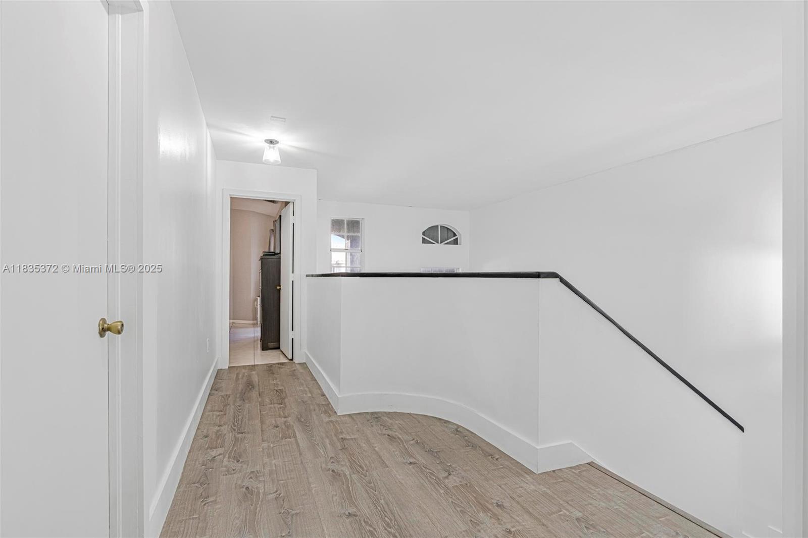 11532 Southwest 148th Path Miami, FL 33196 - Photo 15 of 36 a view of a hallway with wooden floor