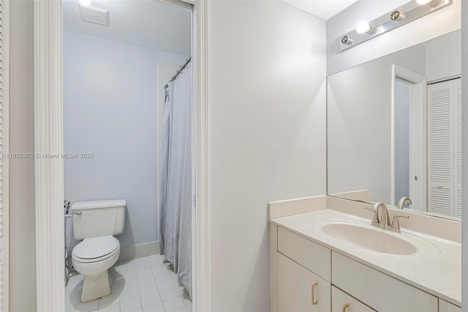 11532 Southwest 148th Path Miami, FL 33196 - Photo 18 of 36 a bathroom with a granite countertop sink toilet and shower