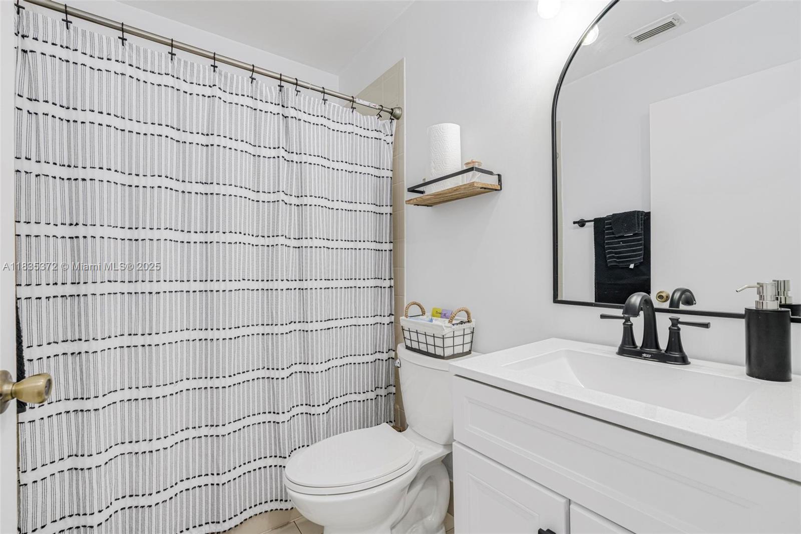 11532 Southwest 148th Path Miami, FL 33196 - Photo 23 of 36 a bathroom with a sink toilet and shower