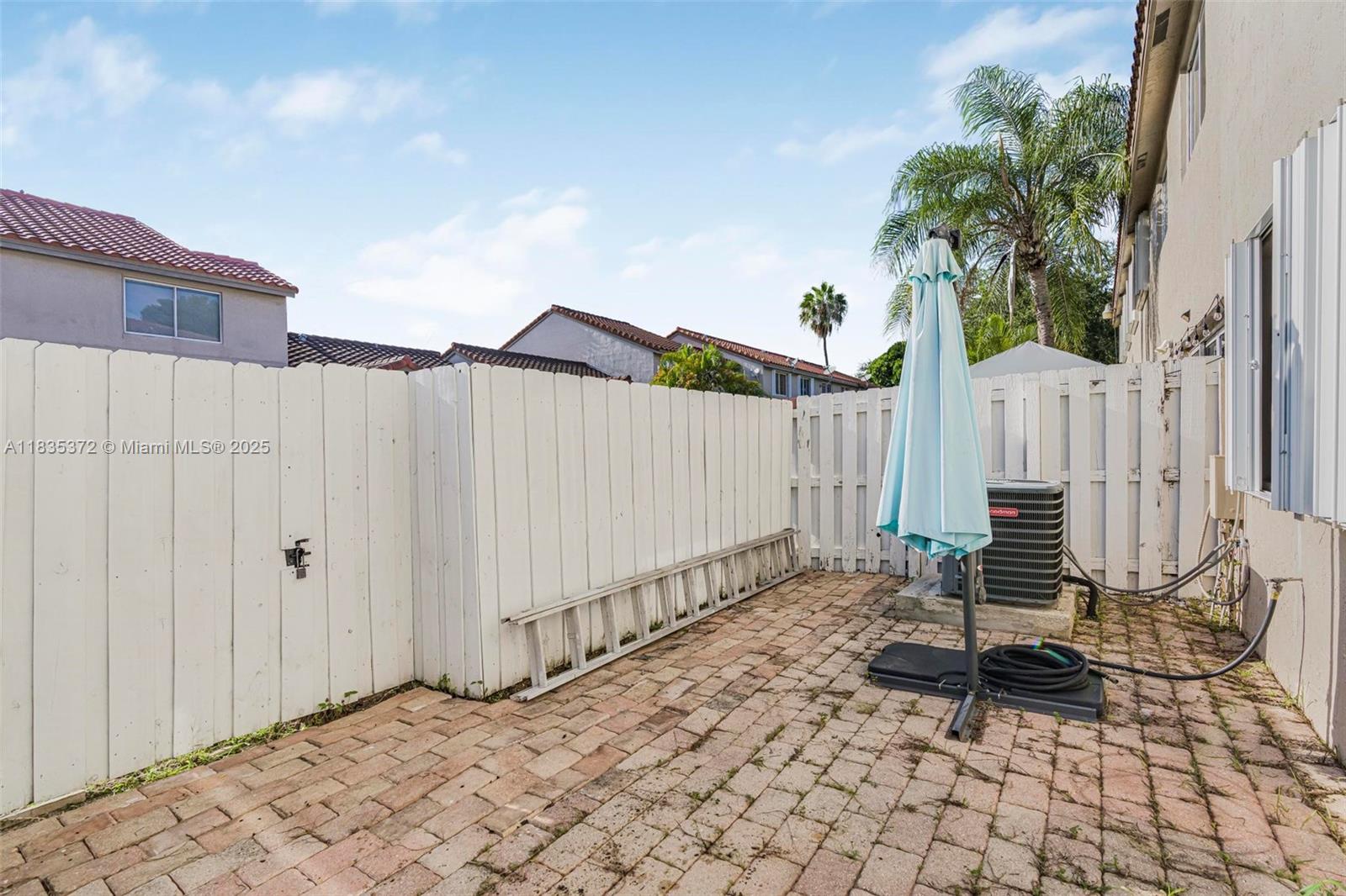 11532 Southwest 148th Path Miami, FL 33196 - Photo 25 of 36 a bench sitting in front of a building