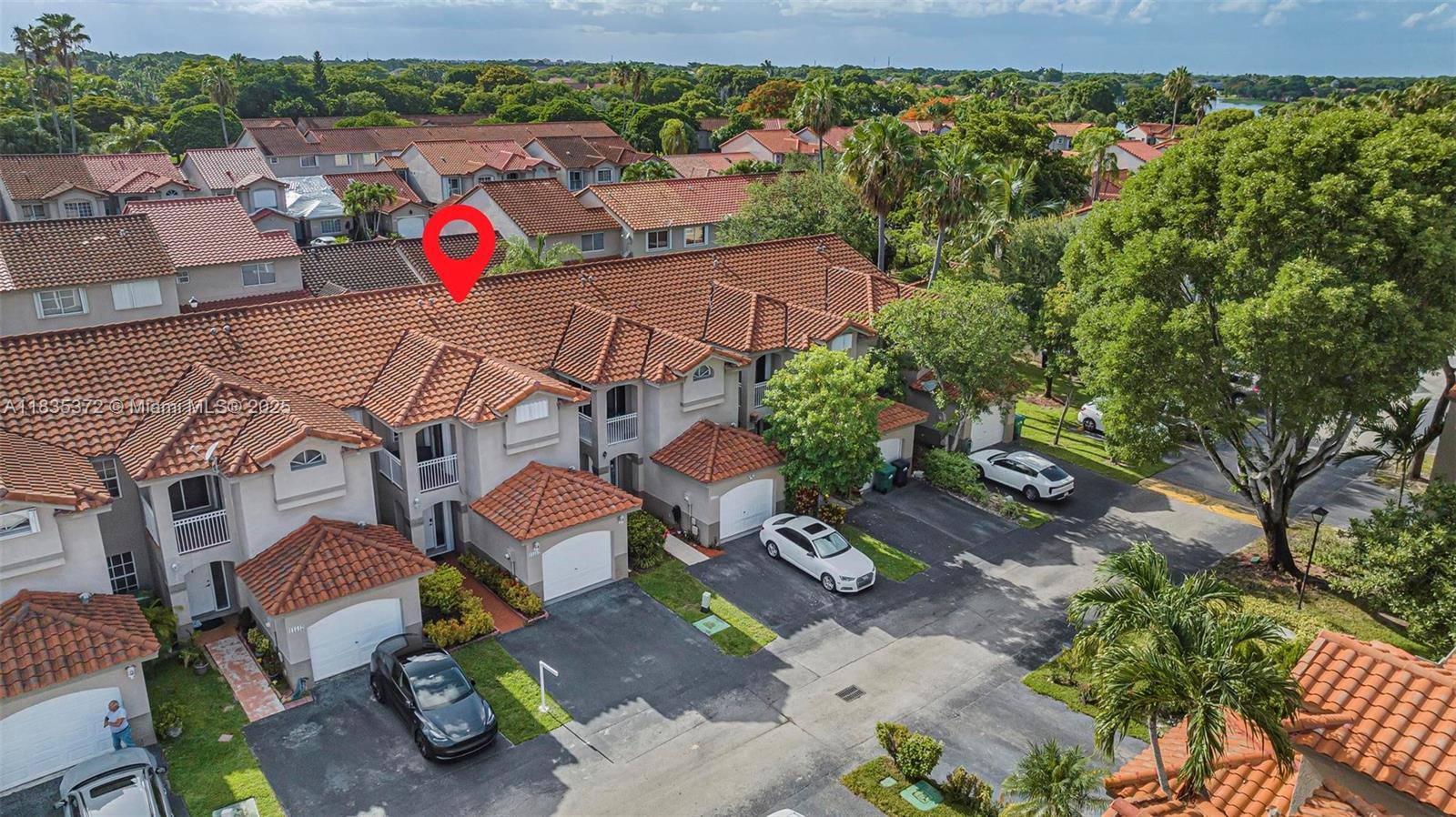 11532 Southwest 148th Path Miami, FL 33196 - Photo 28 of 36 an aerial view of a house with a yard and lake view