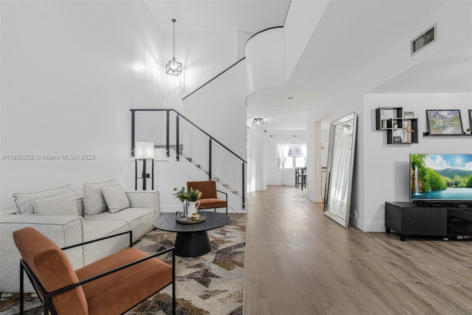 11532 Southwest 148th Path Miami, FL 33196 - Photo 3 of 36 a living room with furniture and a wooden floor