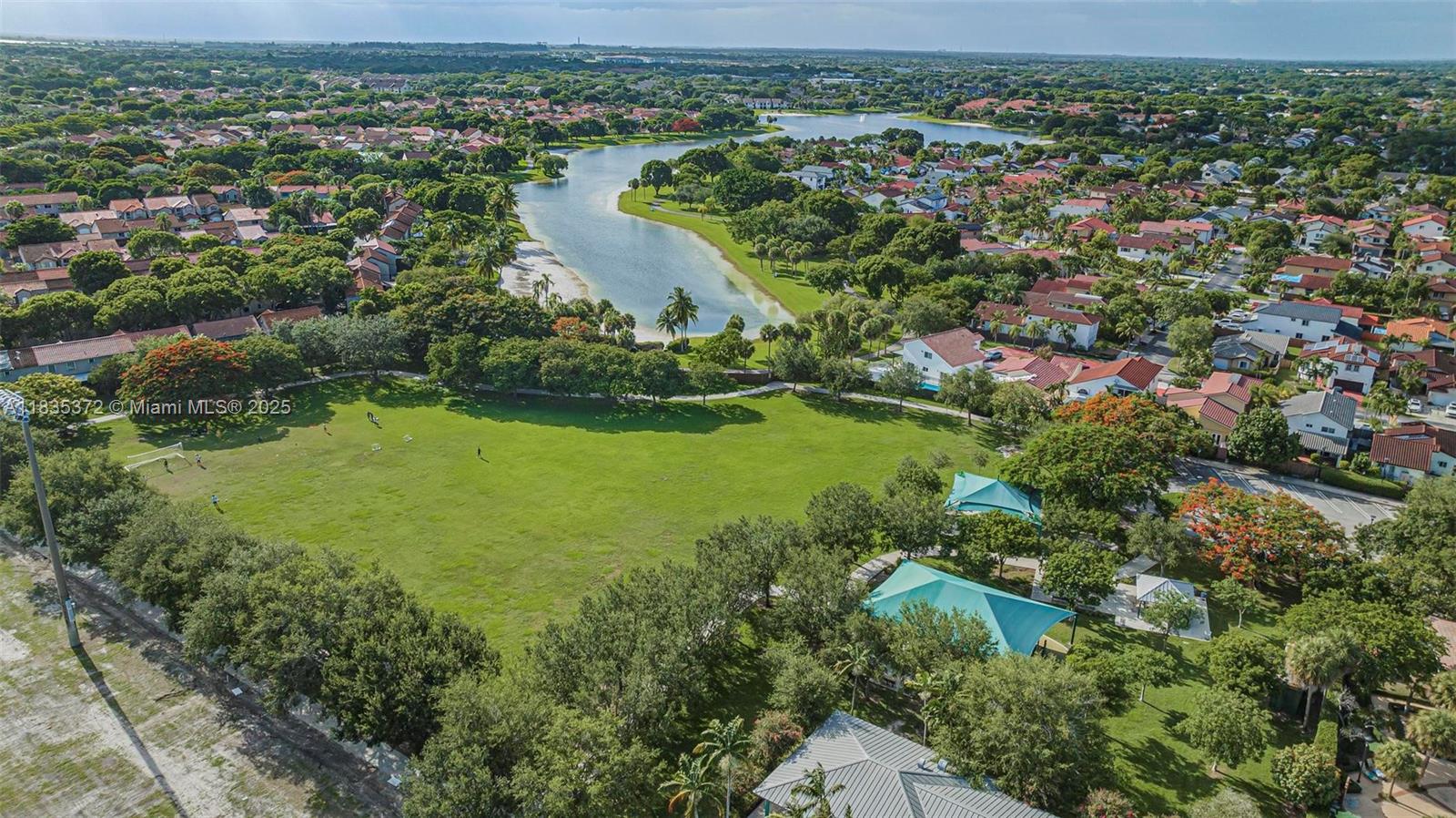 11532 Southwest 148th Path Miami, FL 33196 - Photo 31 of 36 an aerial view of residential houses with outdoor space and trees