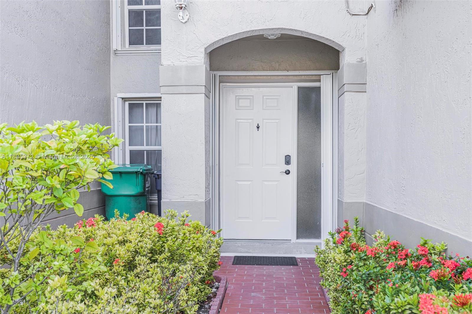 11532 Southwest 148th Path Miami, FL 33196 - Photo 5 of 36 a front view of a house with a yard