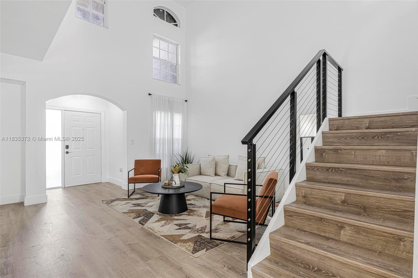 11532 Southwest 148th Path Miami, FL 33196 - Photo 6 of 36 a living room with furniture and wooden floor
