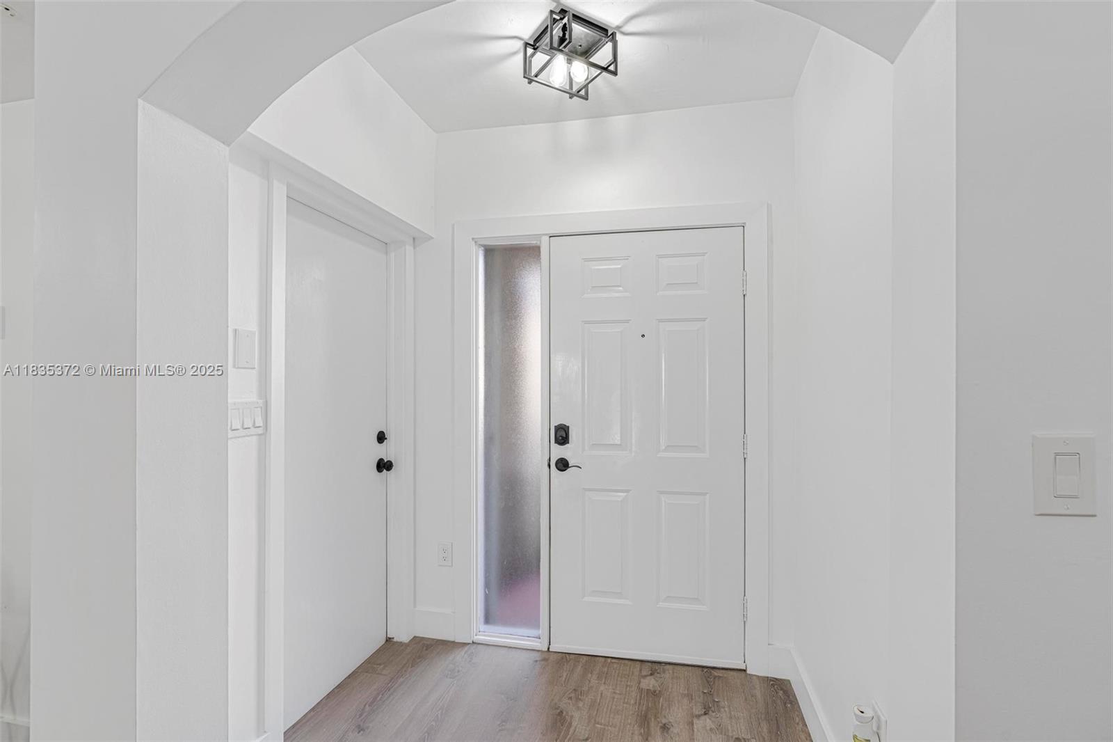 11532 Southwest 148th Path Miami, FL 33196 - Photo 7 of 36 a view of a hallway with a chandelier