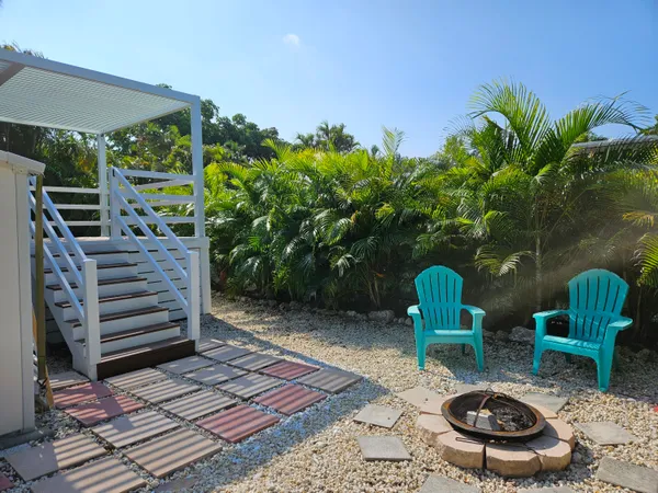 a backyard of a house with seating space