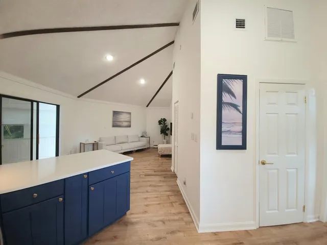 a spacious bathroom with a sink and mirror