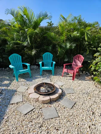 a wooden bench with some trees in the background