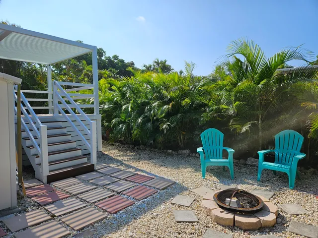 a backyard of a house with seating space