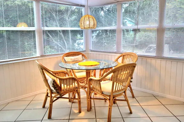 a view of a dining room with furniture and windows