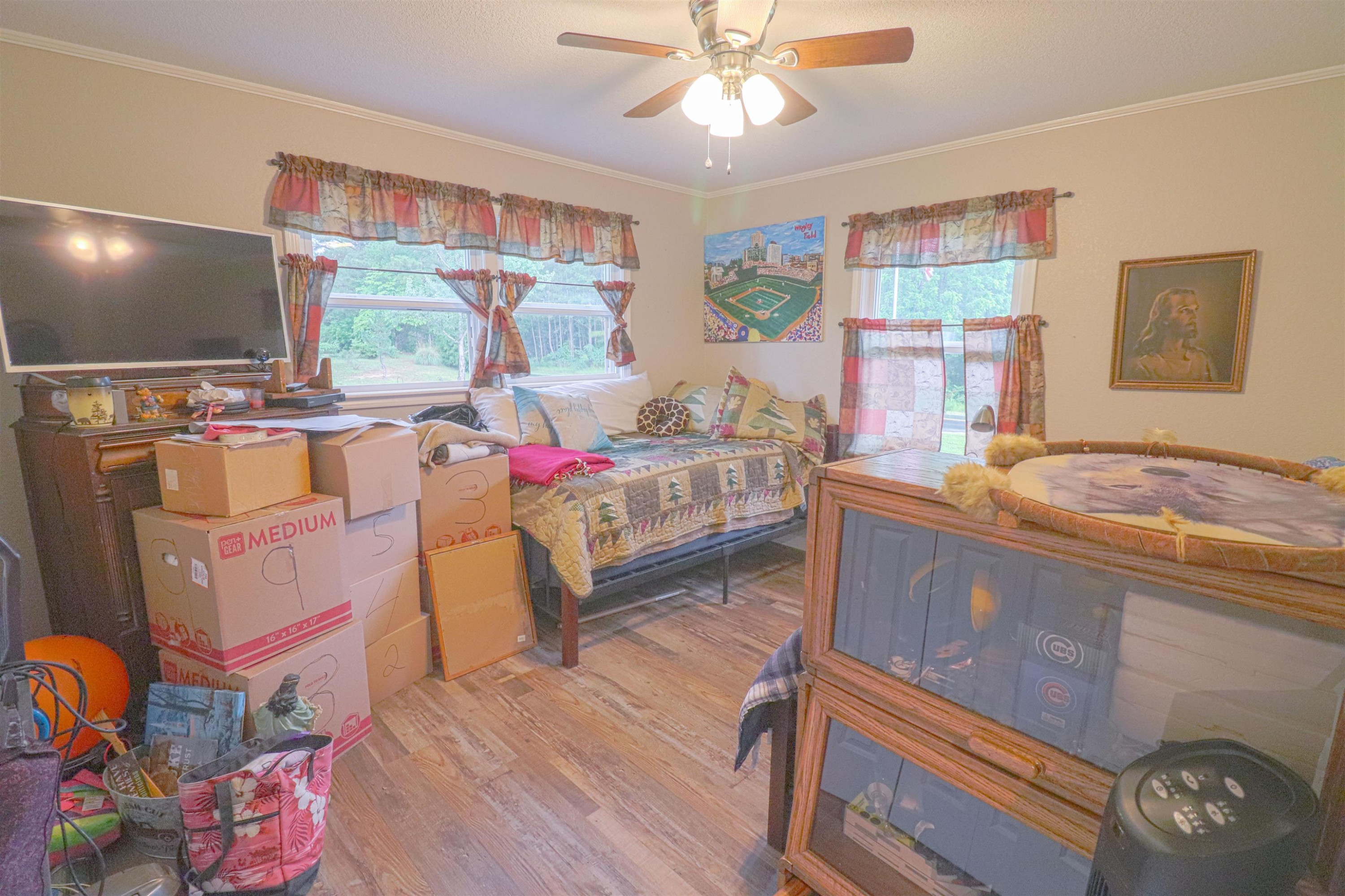 2900 Luray Road Beech Bluff, TN 38313 - Photo 8 of 18 a living room with granite countertop furniture a flat screen tv and a floor to ceiling window