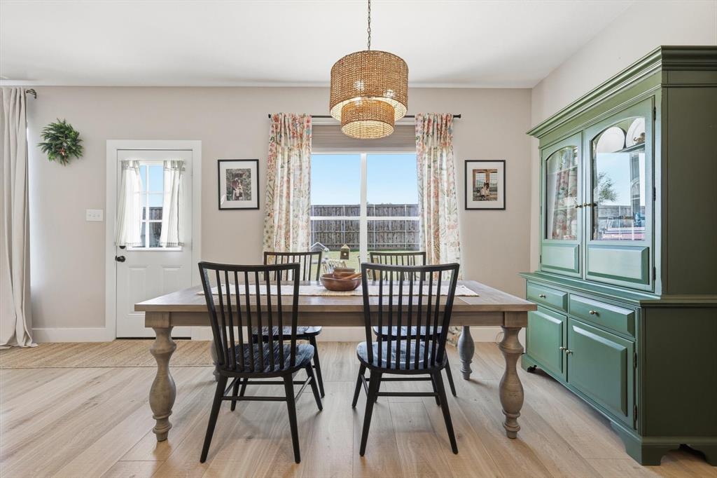 3618 Applewood Road Melissa, TX 75454 - Photo 12 of 39 a view of a dining room with furniture window and wooden floor