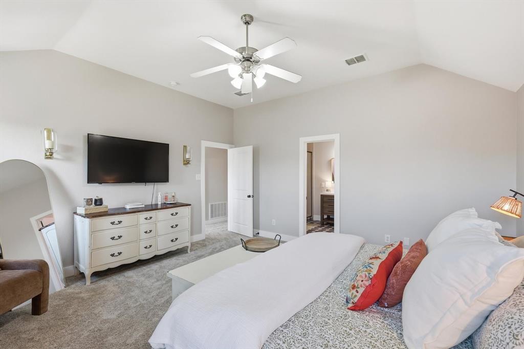 3618 Applewood Road Melissa, TX 75454 - Photo 17 of 39 a bedroom with a bed and a flat screen tv