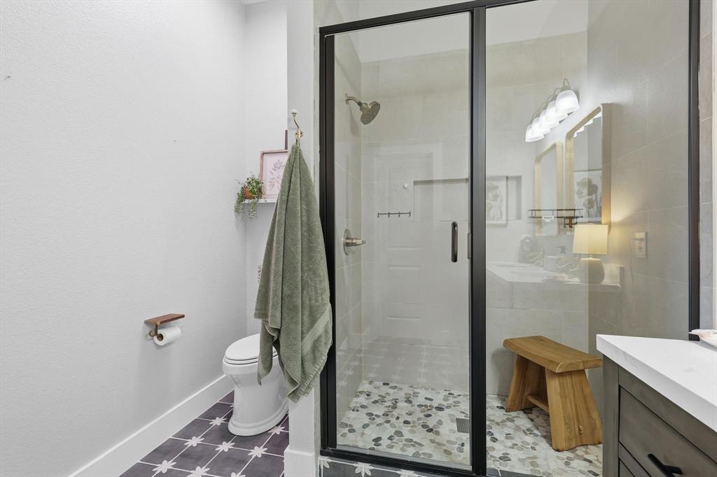 3618 Applewood Road Melissa, TX 75454 - Photo 20 of 39 a bathroom with a granite countertop shower and a toilet